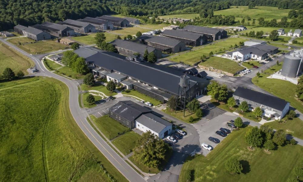 Aerial view of a distillery campus with multiple buildings and access roads for an ALTA title survey