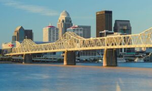 louisville kentucky elevation certificate flood risk - ALTA SURVEY Kentucky Louisville, Kentucky skyline and bridge over the Ohio River at sunset, showing areas where flood risk and elevation certificates may apply.