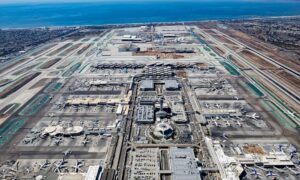 Aerial view of airport, showing runways, terminals, and surrounding buildings for aerial surveying and height review