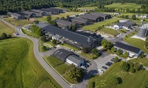 Distillery campus alta title survey - ALTA SURVEY Kentucky Aerial view of a distillery campus with multiple buildings and access roads for an ALTA title survey