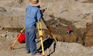 Site elevation survey construction - ALTA SURVEY Kentucky Surveyor measuring ground elevations at a construction site