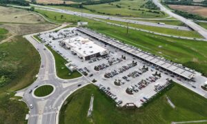 Alta survey commercial site aerial view - ALTA SURVEY Kentucky Aerial view of a commercial property with parking areas, access roads, and surrounding open land